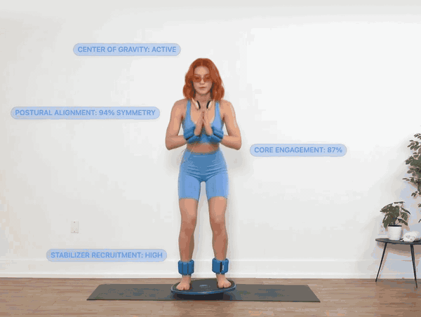 A woman balancing on the GoBalance Sport board while the app reads her posture, core engagement and stabiliser recruitment